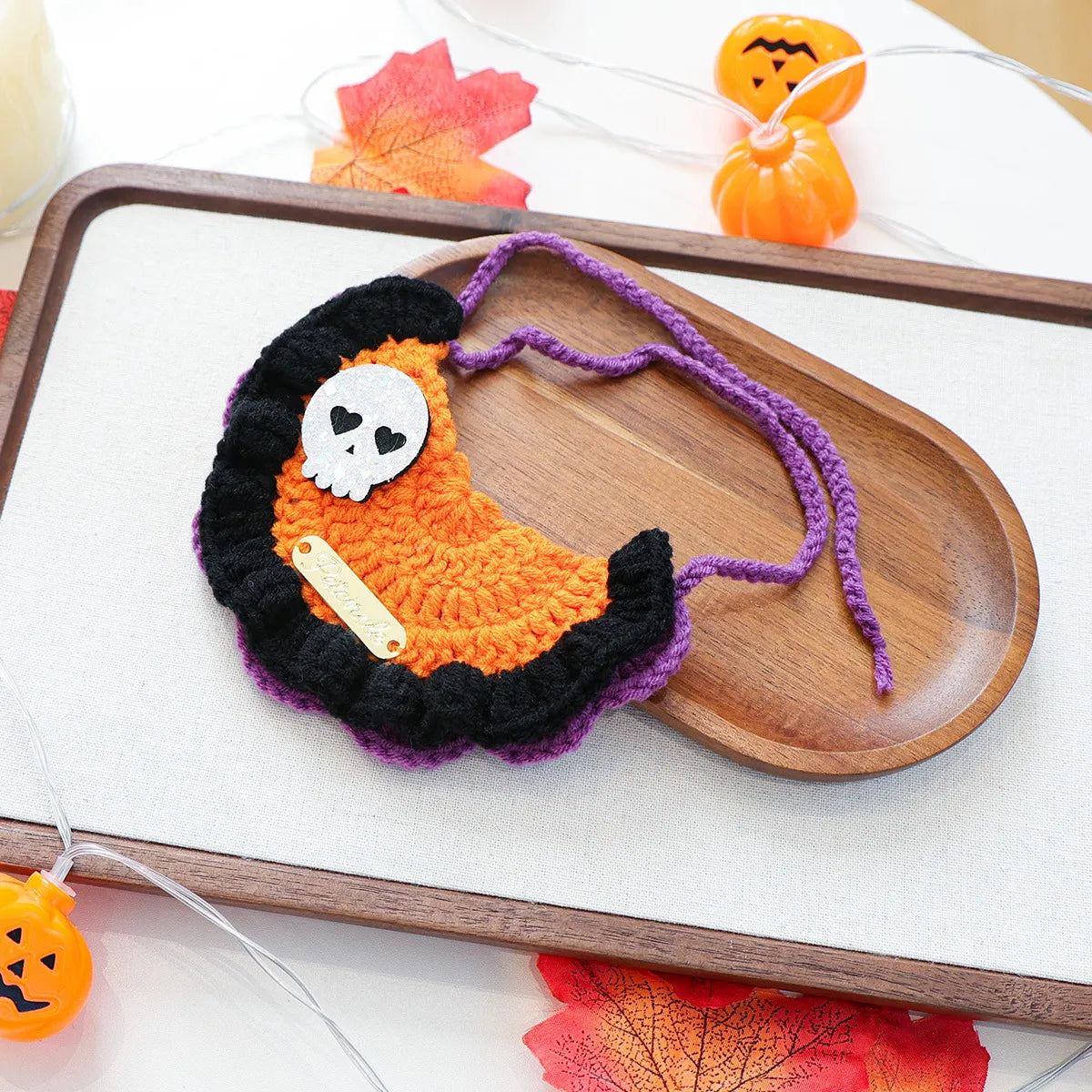 Extra variation of black pumpkin design Halloween gold-label yarn bib.