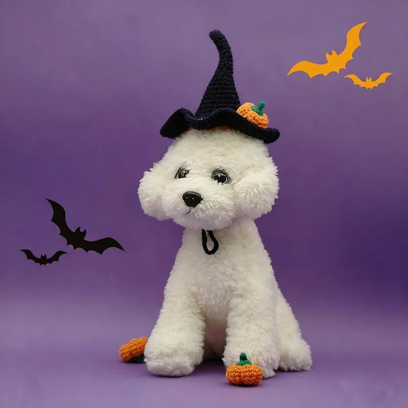 Dog wearing navy blue Halloween witch hat with orange pumpkin detail