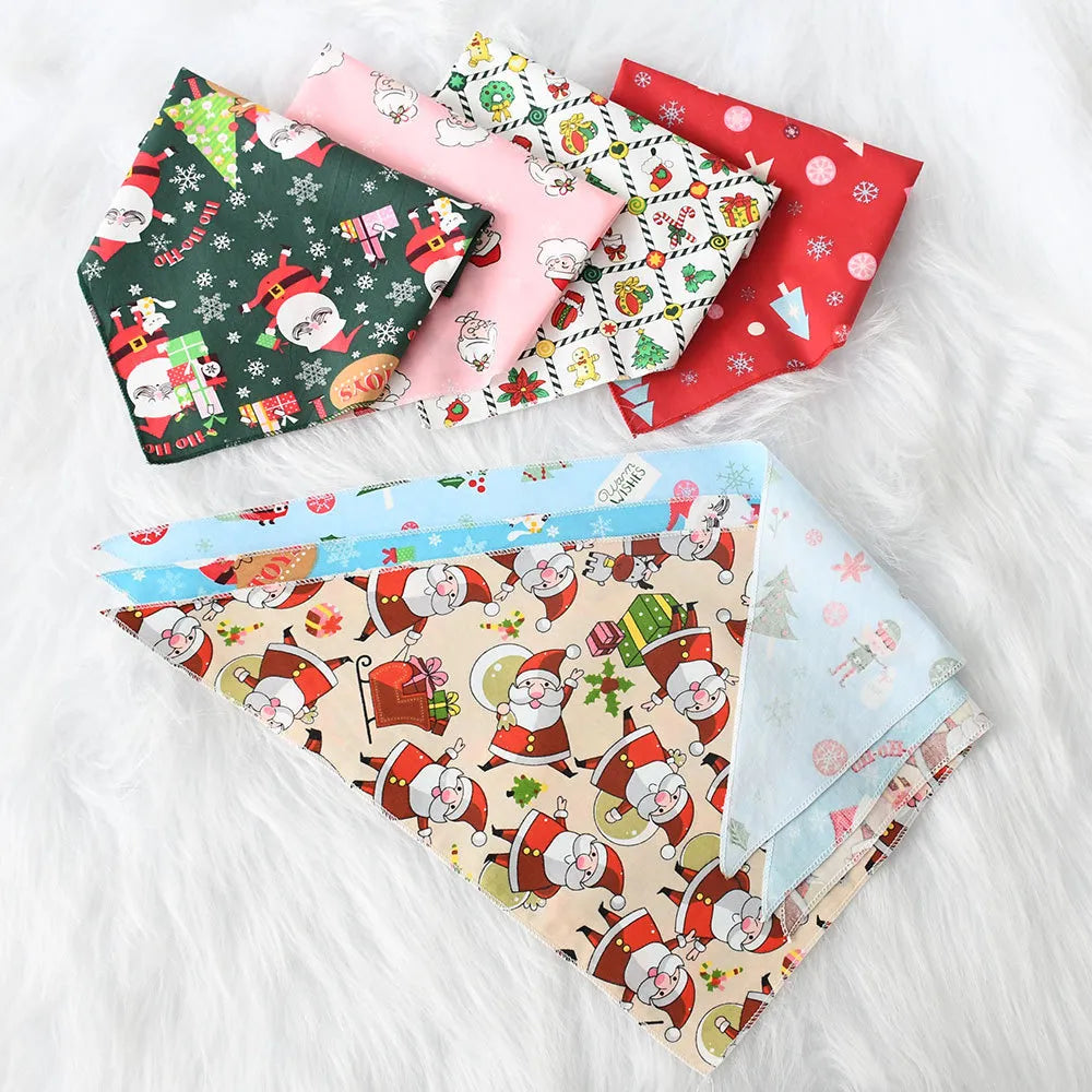 Folded multicolor Christmas pet bandanas arranged for display