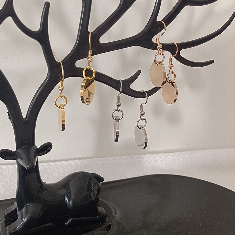 Jewelry tree display showing multiple custom pet face earring styles