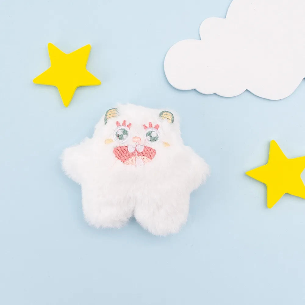 White plush one-eyed pet toy with star accents