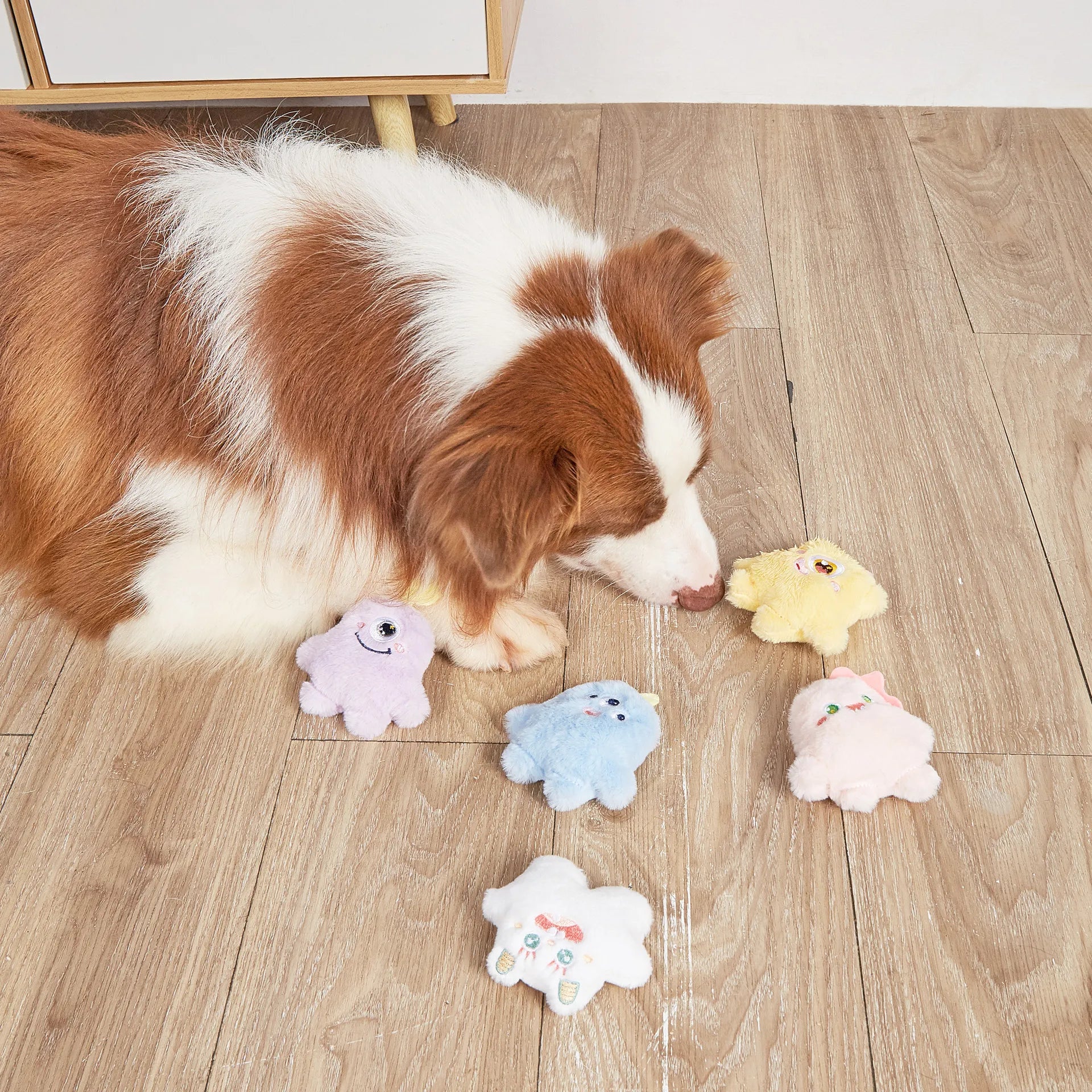 Blue plush one-eyed pet toy with cartoon design