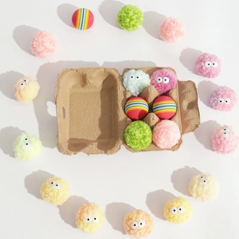 Flat lay of pastel egg-shaped yarn balls