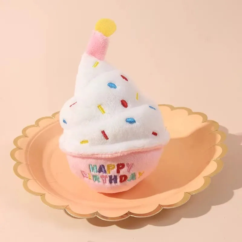Plush birthday cake toy displayed on plate
