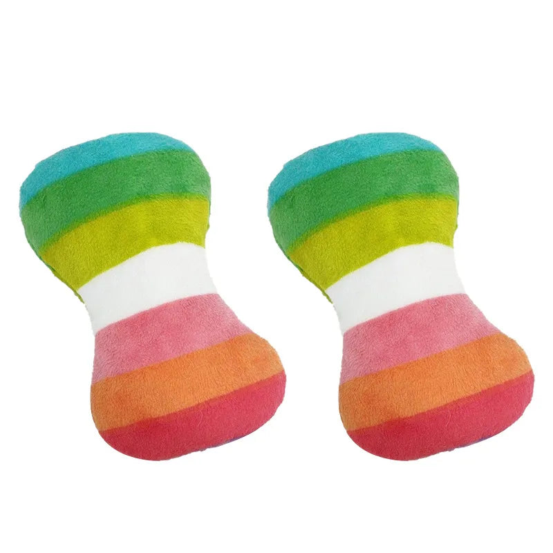 Two rainbow-colored squeaky bone toys for dogs