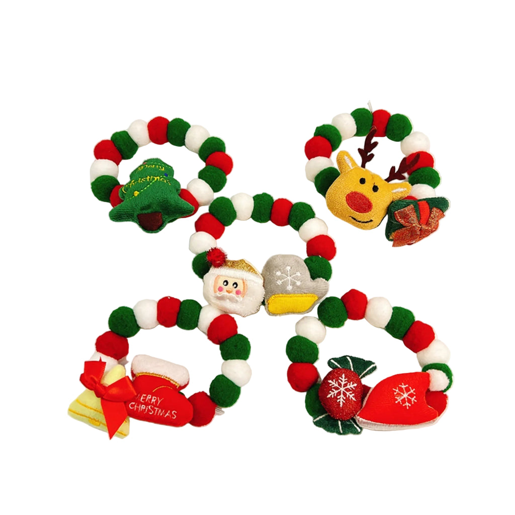 Flat lay of multicolor Christmas pet collars with festive ornaments
