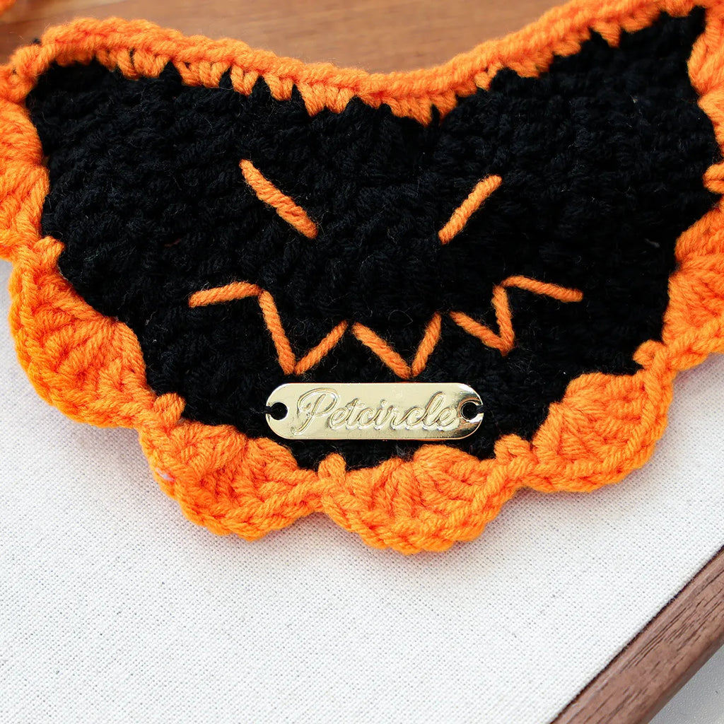 Black pumpkin design Halloween gold-label yarn bib, spooky pet outfit.

