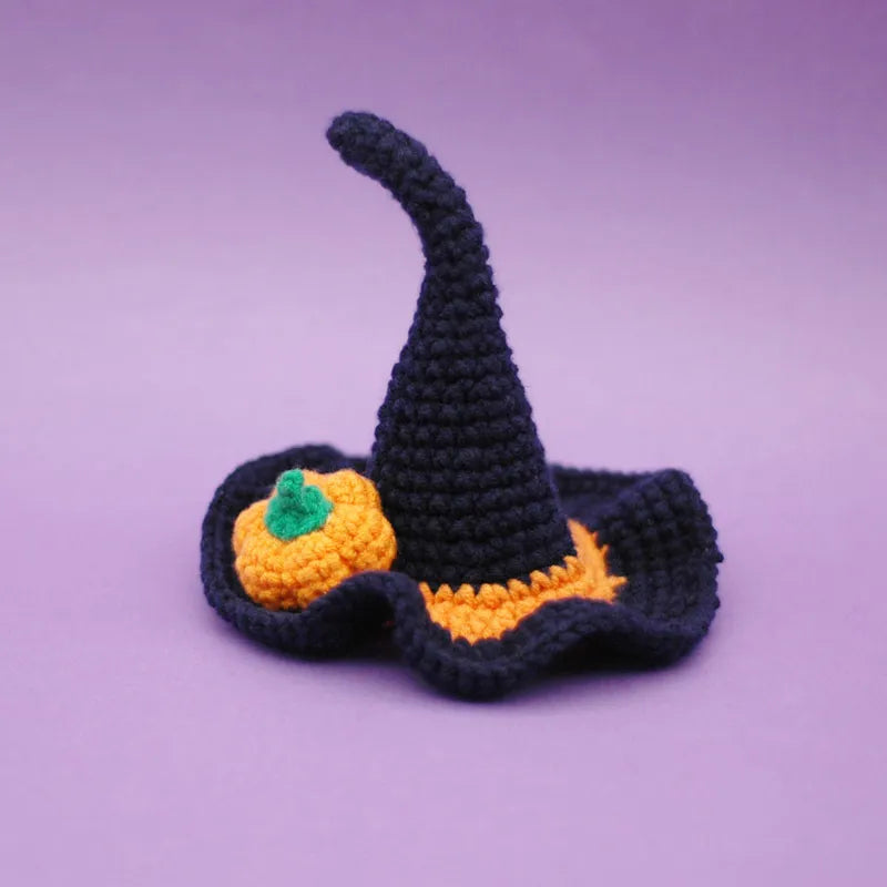 Close-up of navy blue Halloween pet witch hat with festive design
