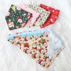 Folded multicolor Christmas pet bandanas arranged for display