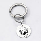 Silver pet face keychain featuring a single engraved pendant with pet photo.

