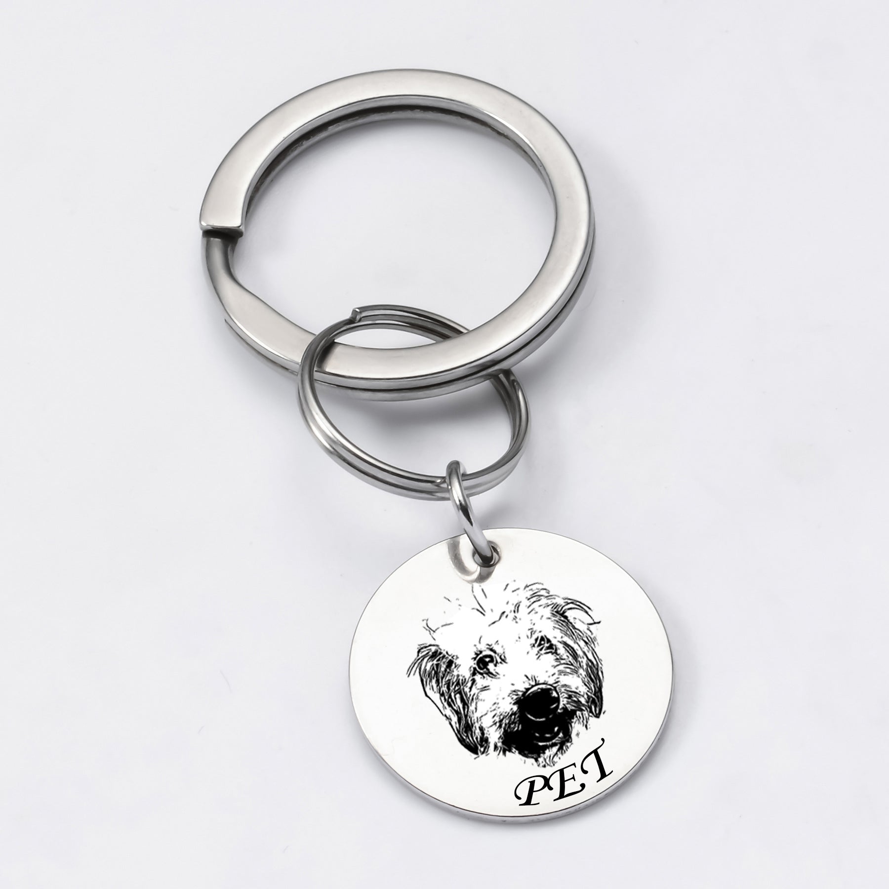 Silver pet face keychain featuring a single engraved pendant with pet photo.
