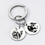 Silver pet face keychain with two custom engraved pendants.
