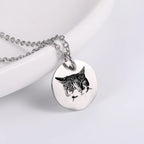 Custom silver pet face necklace with engraved pet design.
