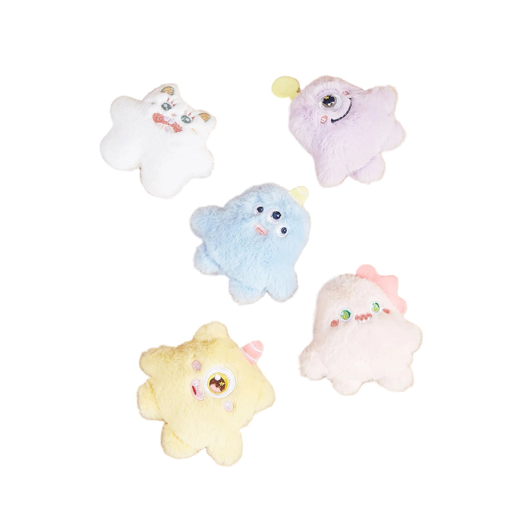 Flat lay of multi-color plush one-eyed pet toys (set 1)

