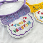 Embroidery detail of “Happy Birthday” on bib