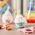 Plush birthday cake toys at pet birthday party