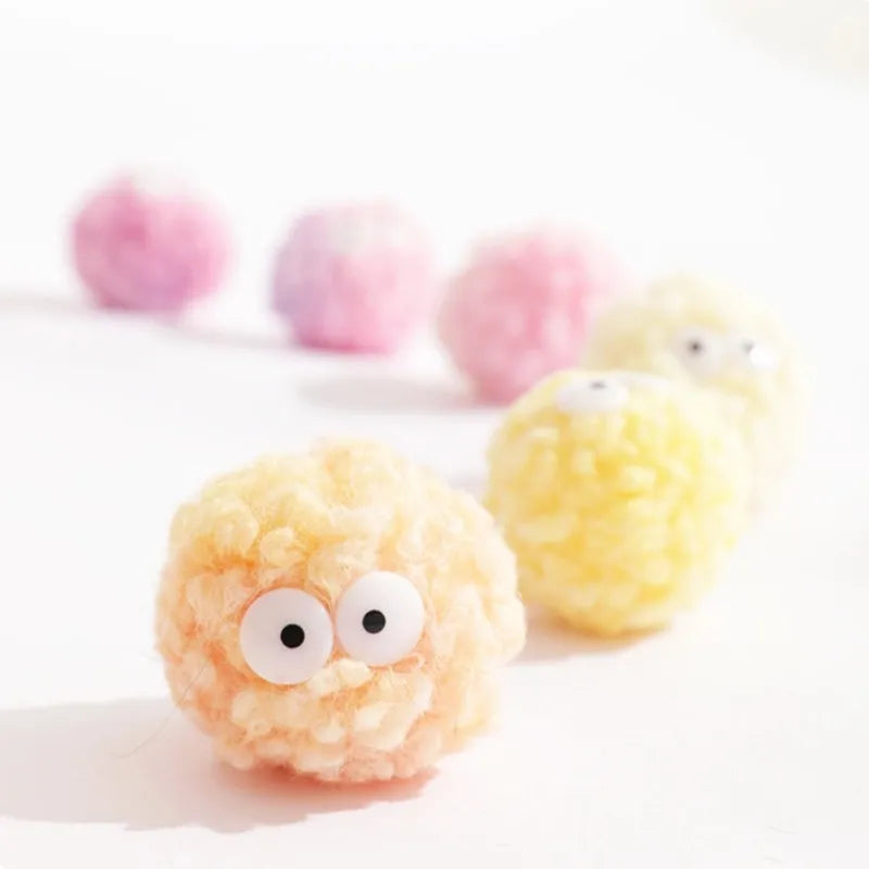 Chick-shaped yarn ball among egg-shaped toys