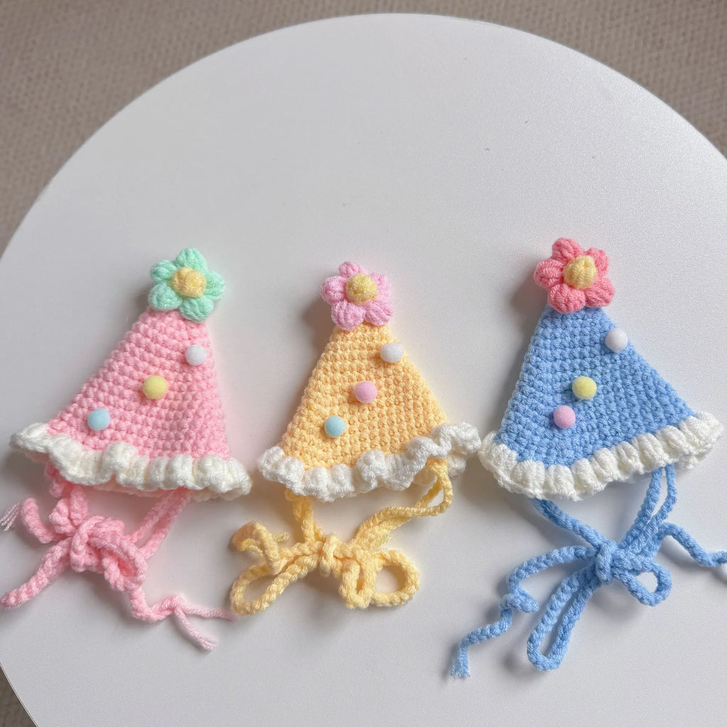 Pastel-colored knitted birthday hats for pets