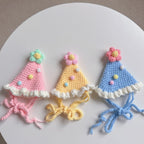 Pastel-colored knitted birthday hats for pets