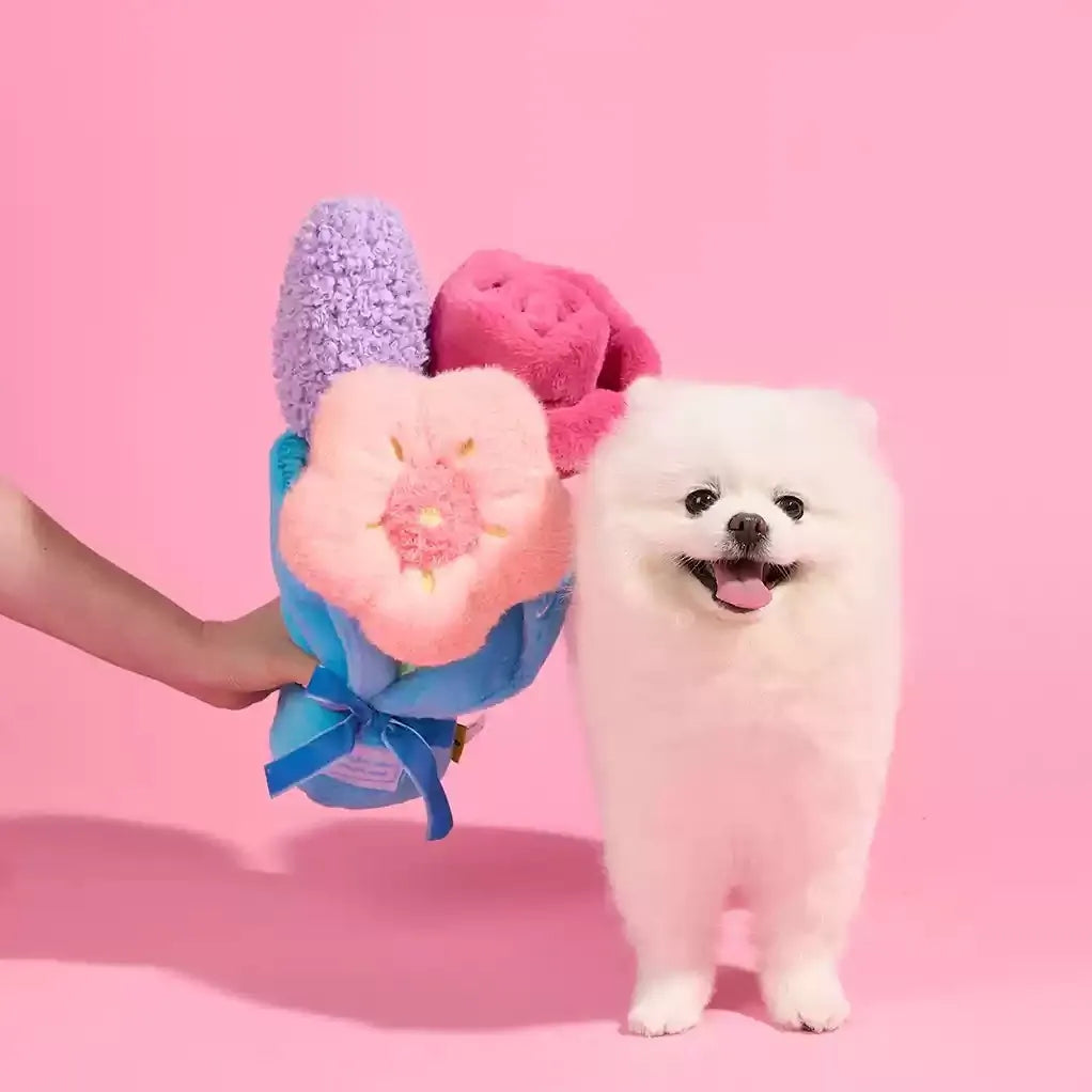 Dog with plush flower bouquet toy