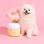 Dog with pink plush flower bouquet toy