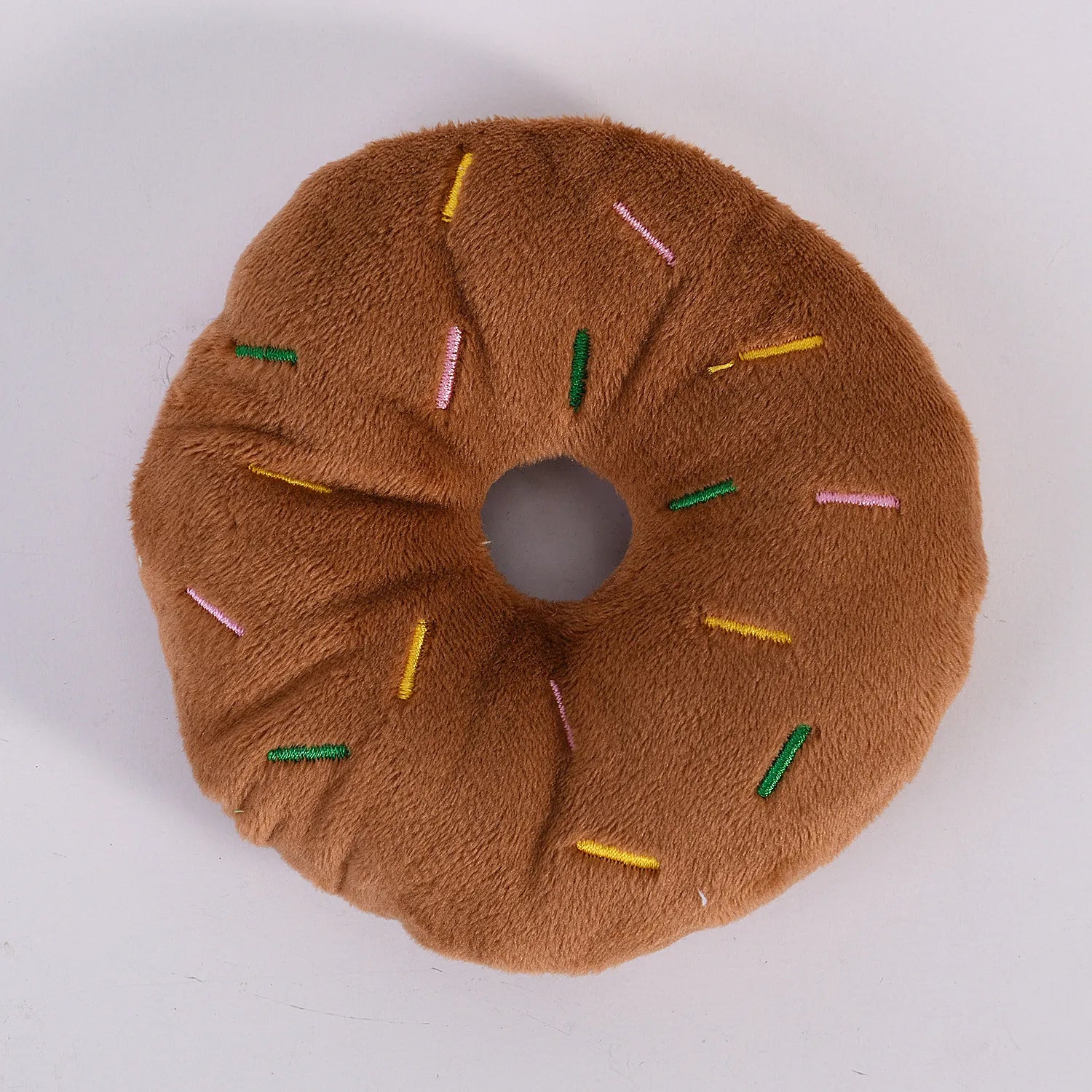 Brown squeaky plush donut toy for dogs
