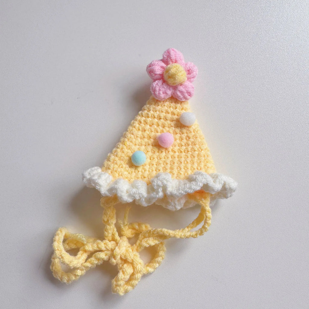 Yellow knitted birthday hat with pom-pom for pets