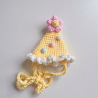 Yellow knitted birthday hat with pom-pom for pets