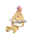 Yellow knitted pet party hat with pink pom-pom